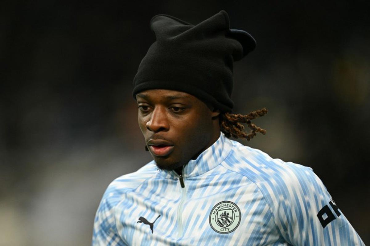 Manchester City's Belgian midfielder #11 Jeremy Doku warms up ahead of the English League Cup semi-final first leg football match between Newcastle United and Manchester City at St James' Park in Newcastle-upon-Tyne, north east England on January 13, 2026. Oli SCARFF / AFP