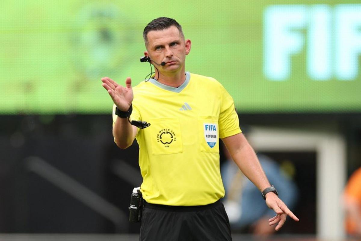 English referee Michael Oliver gestures during the FIFA Club World Cup 2025 Group F football match between Brazil's Fluminense and South Korea's Ulsan HD at the MetLife stadium in East Rutherford, New Jersey on June 21, 2025. CHARLY TRIBALLEAU / AFP