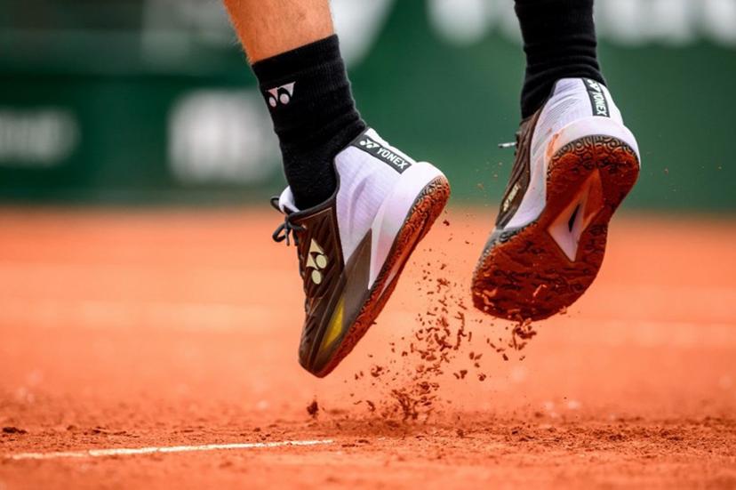 The shoes of Norway's Casper Ruud are seen during his match against Austria's Sebastian Ofner at the ATP 250 Geneva Open tennis tournament, in Geneva, on May 22, 2024. Fabrice COFFRINI / AFP