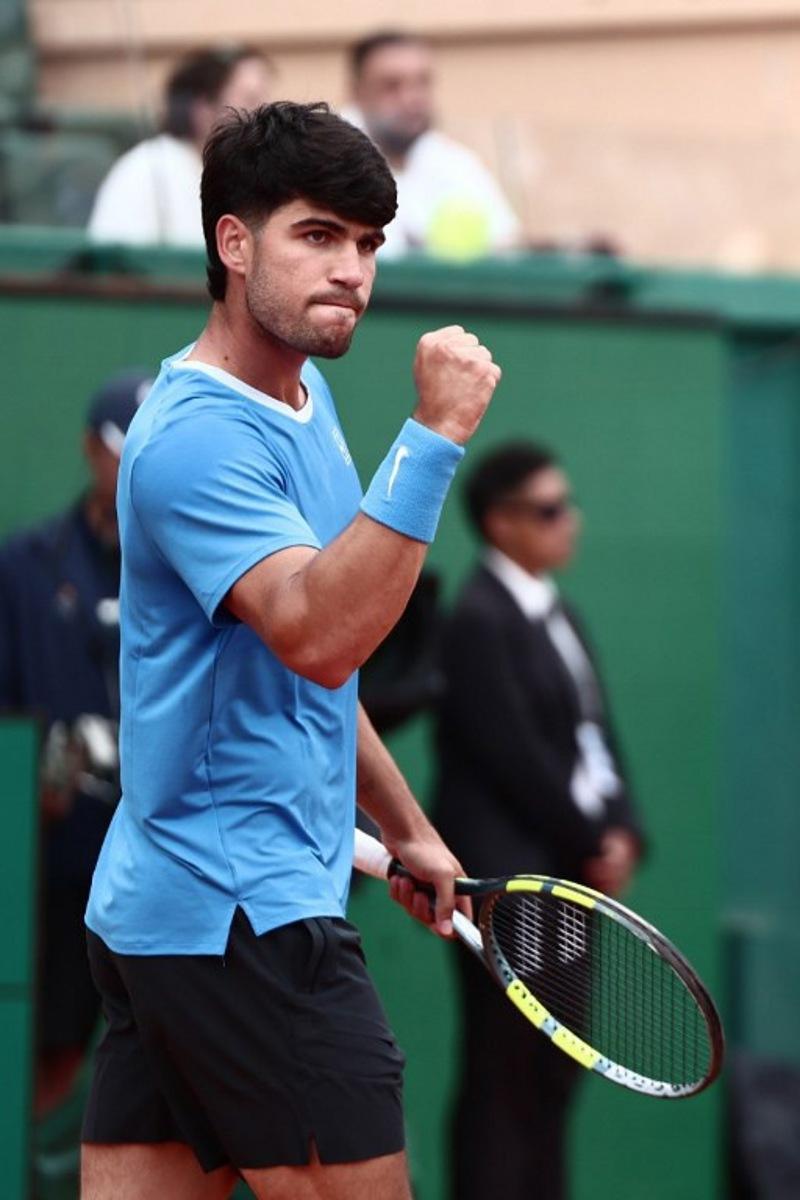 Spain's Carlos Alcaraz celebrates a point against Kazakhstan's Alexander Bublik during the Monte Carlo ATP Masters Series Tournament quarter final tennis match on Court Rainier III at the Monte-Carlo Country Club in Roquebrune-Cap-Martin, south-eastern France on April 10, 2026. Thibaud MORITZ / AFP