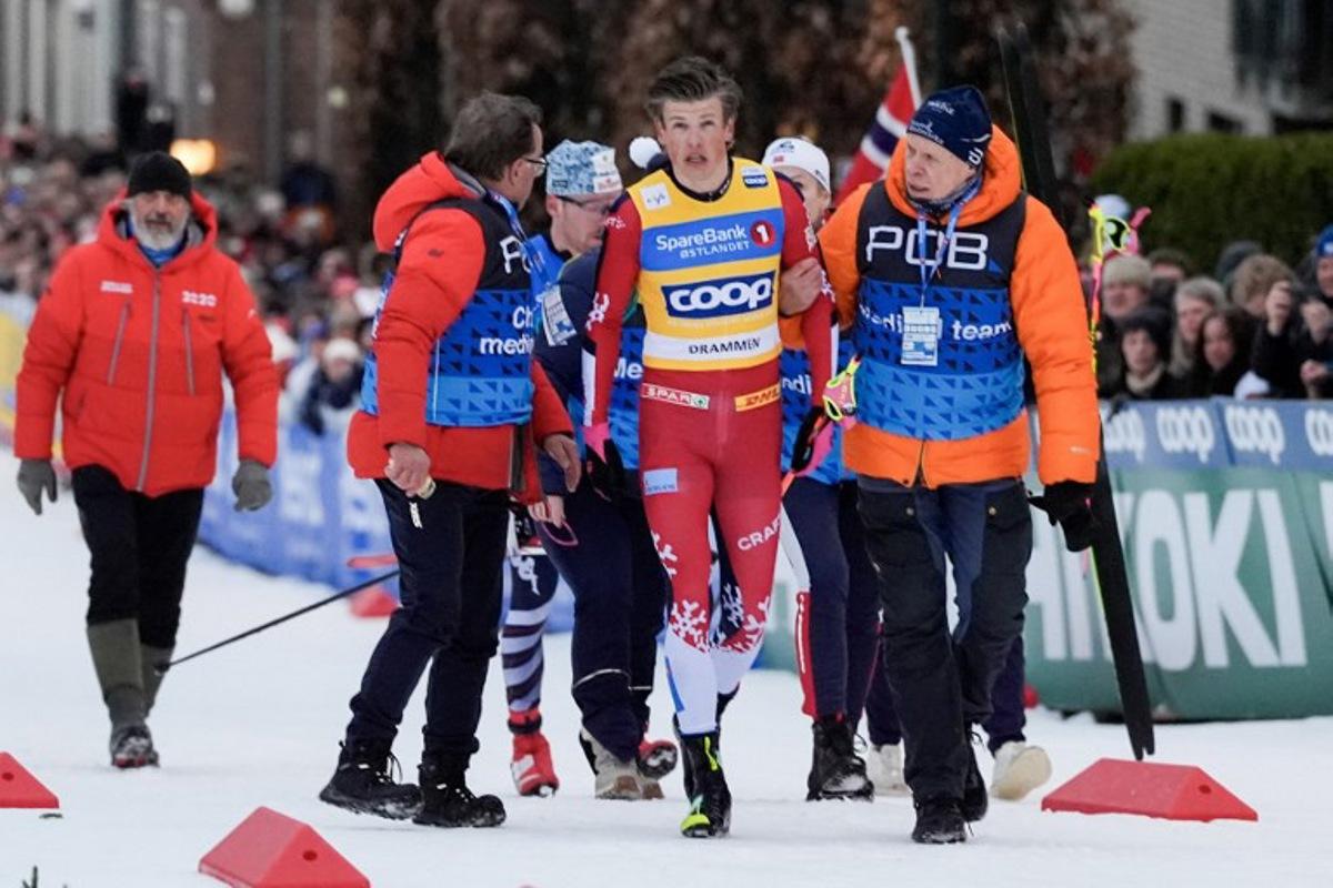 Johannes Hosflot Klaebo reacts after falling during the World Cup sprint cross-country race in Drammen, Norway on March 12, 2026. Lise Åserud / NTB / AFP