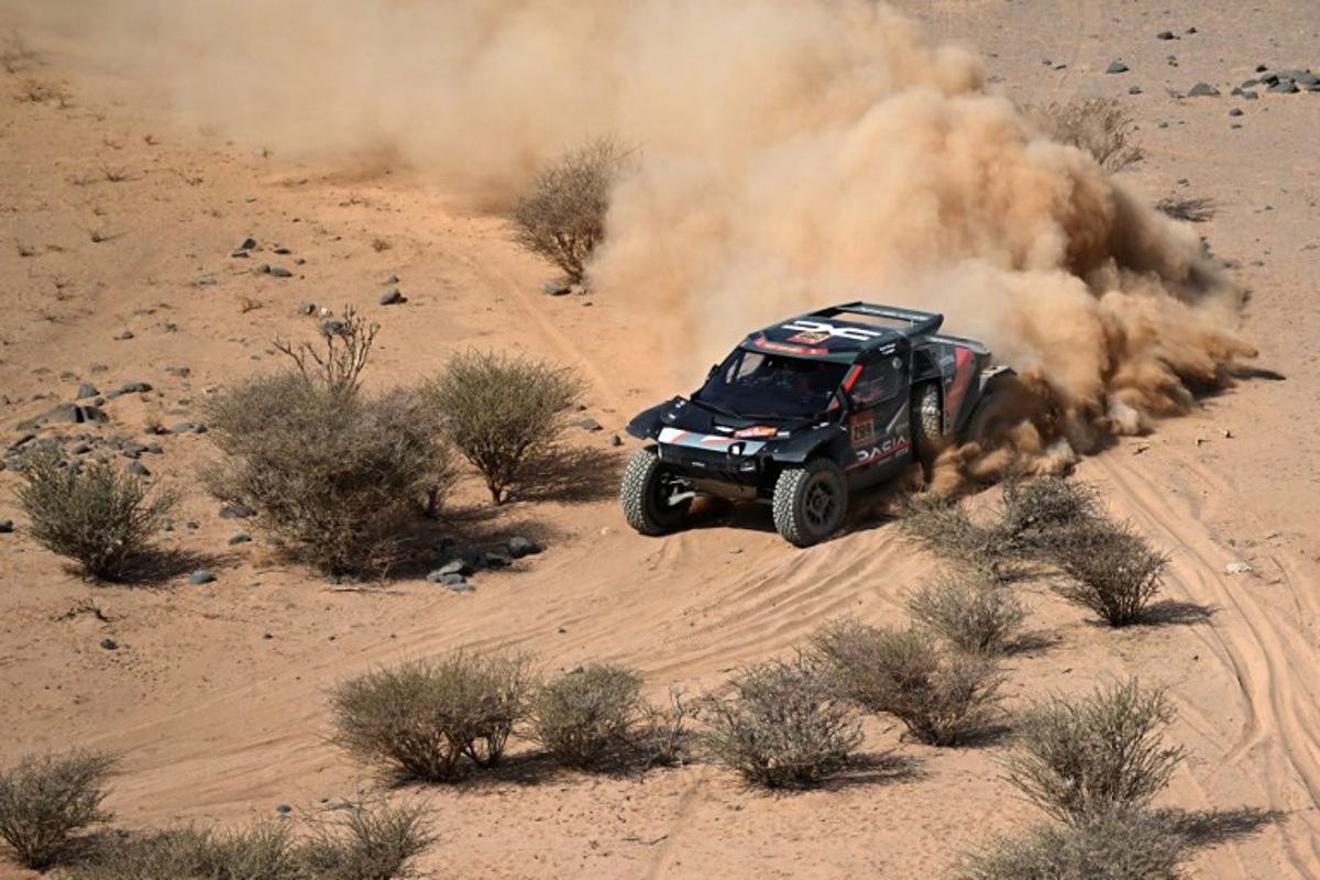 The Dacia Sandriders's Qatari driver Nasser Al‑Attiyah and Belgian co‑pilot Fabian Lurquin compete in Stage 11 of the 48th edition of the Dakar Rally 2026, between Bisha and al-Henakiyah, Saudi Arabia, on January 15, 2026. Giuseppe CACACE / AFP