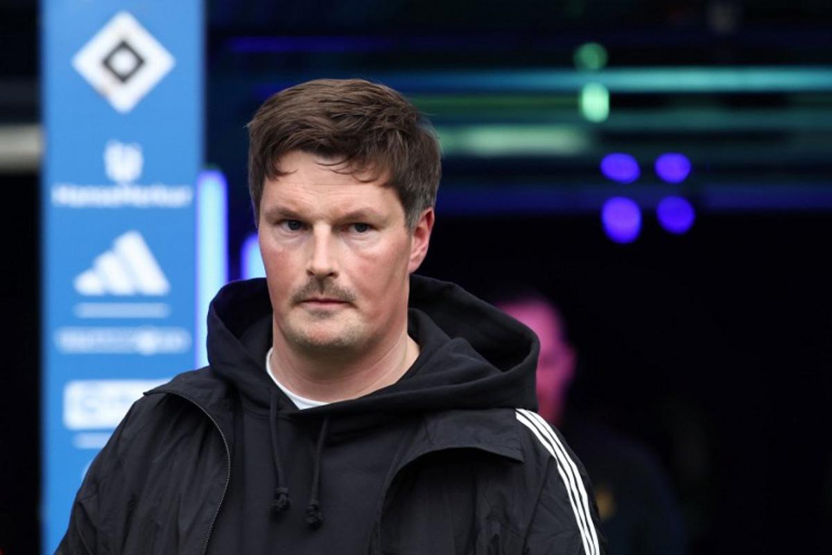 Hamburg's German head coach Merlin Polzin looks on prior to the German first division Bundesliga football match between Hamburger SV and TSG 1899 Hoffenheim in Hamburg, northern Germany on April 25, 2026. Ibrahim OT / AFP
