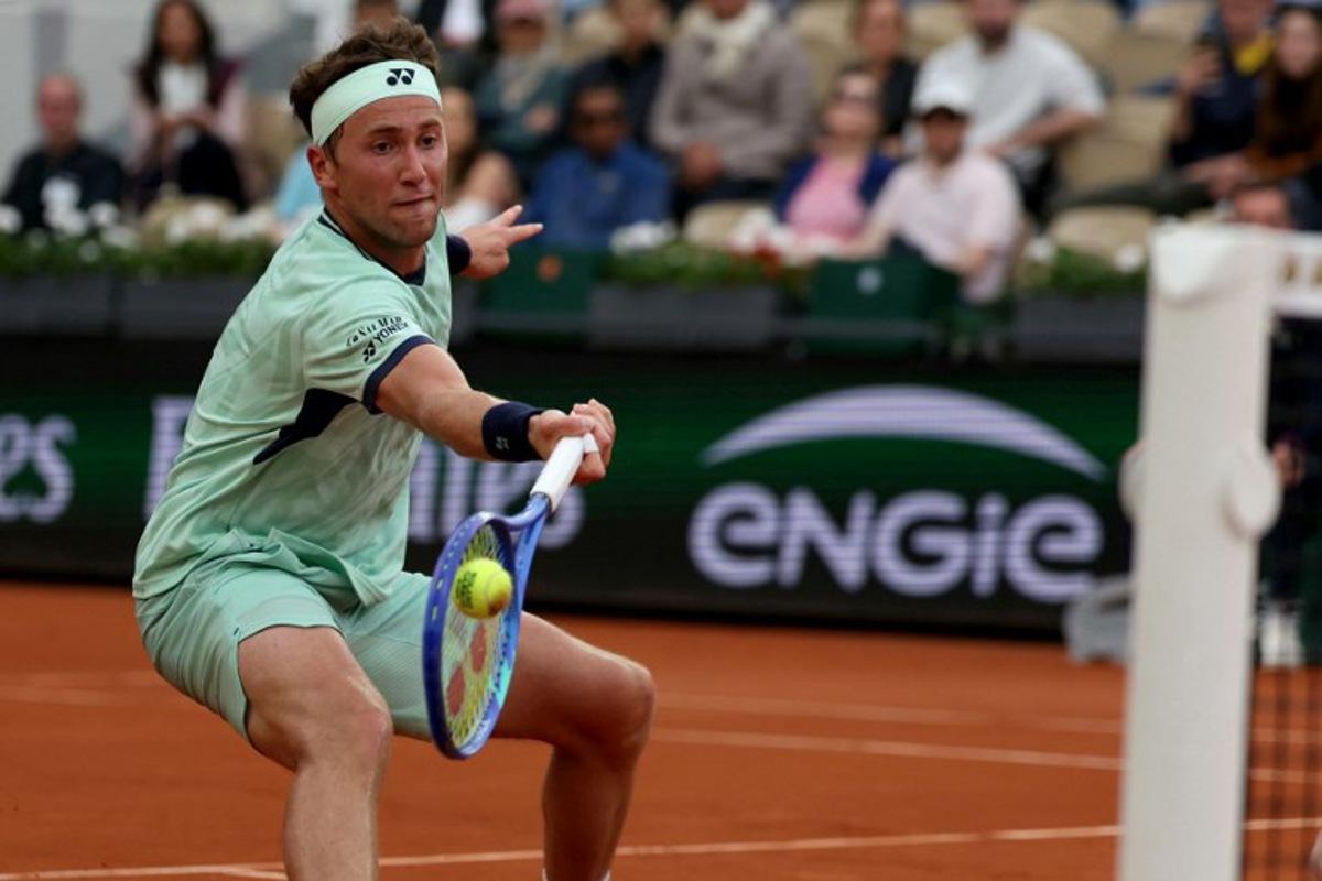 Norway's Casper Ruud plays a forehand return to Portugal's Nuno Borges during their men's singles match on day 4 of the French Open tennis tournament on Court Suzanne-Lenglen at the Roland-Garros Complex in Paris on May 28, 2025. ALAIN JOCARD / AFP