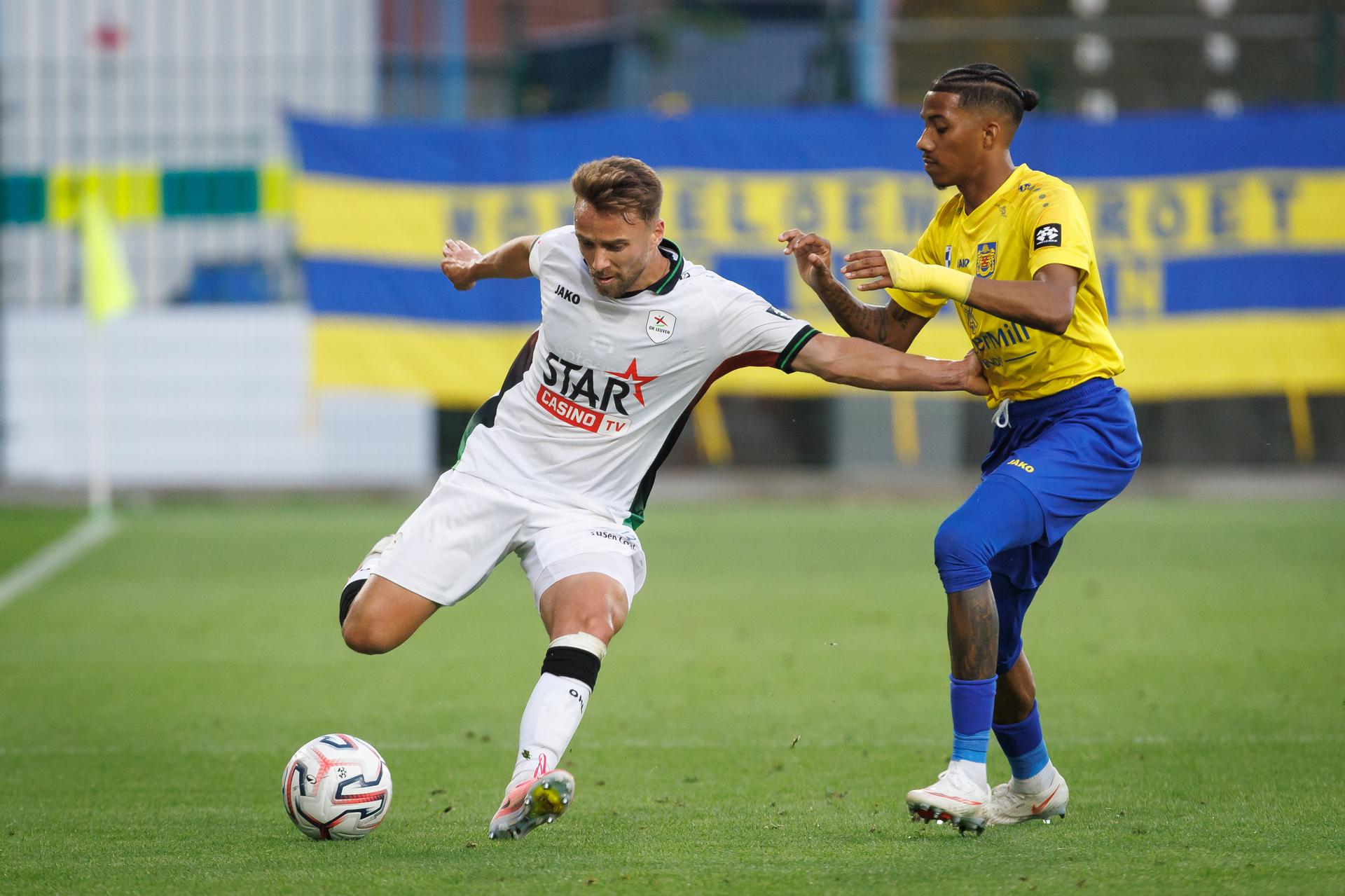 OHL's Wouter George and Beveren's Jearl Margaritha fight for the ball during a soccer match between SK Beveren and OH Leuven, Sunday 6 September 2026 in Beveren, on day 5 of the 2026-2027 'Jupiler Pro League' first division of the Belgian championship. BELGA PHOTO KURT DESPLENTER
