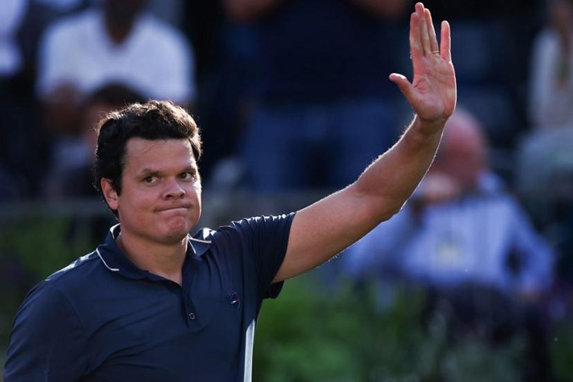 Canada's Milos Raonic celebrates after winning against Britain's Cameron Norrie during the men's singles round of 32 match at the cinch ATP tennis Championships at Queen's Club in west London on June 17, 2024. HENRY NICHOLLS / AFP