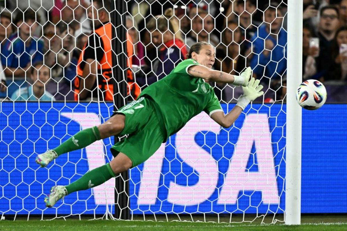 Germany's goalkeeper #01 Ann-Katrin Berger saves France's first penalty during a penalty shootout at the end of the extra time in the UEFA Women's Euro 2025 quarter finals football match between France and Germany at the Parc Saint-Jacques (St. Jakob Park) stadium in Basel, on July 19, 2025. Fabrice COFFRINI / AFP