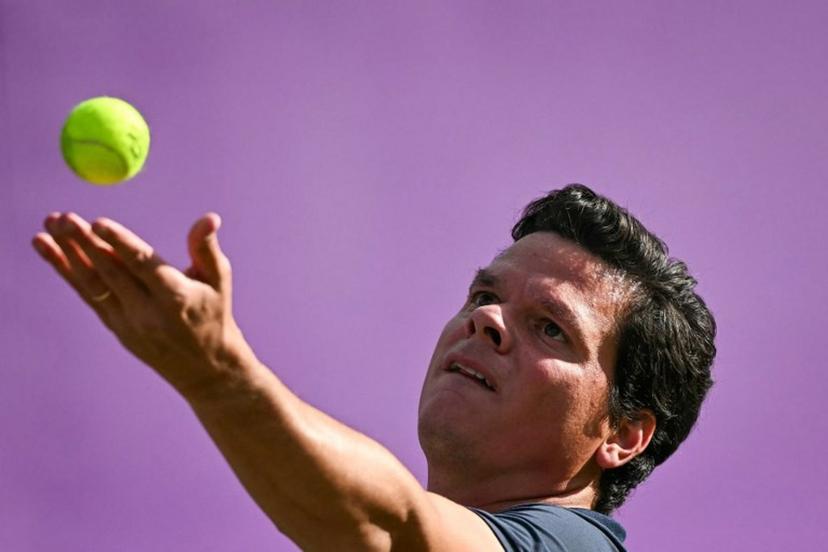 Canada's Milos Raonic serves against US player Taylor Fritz during their men's singles round of 16 match at the Cinch ATP tennis Championships at Queen's Club in west London on June 19, 2024. Ben Stansall / AFP