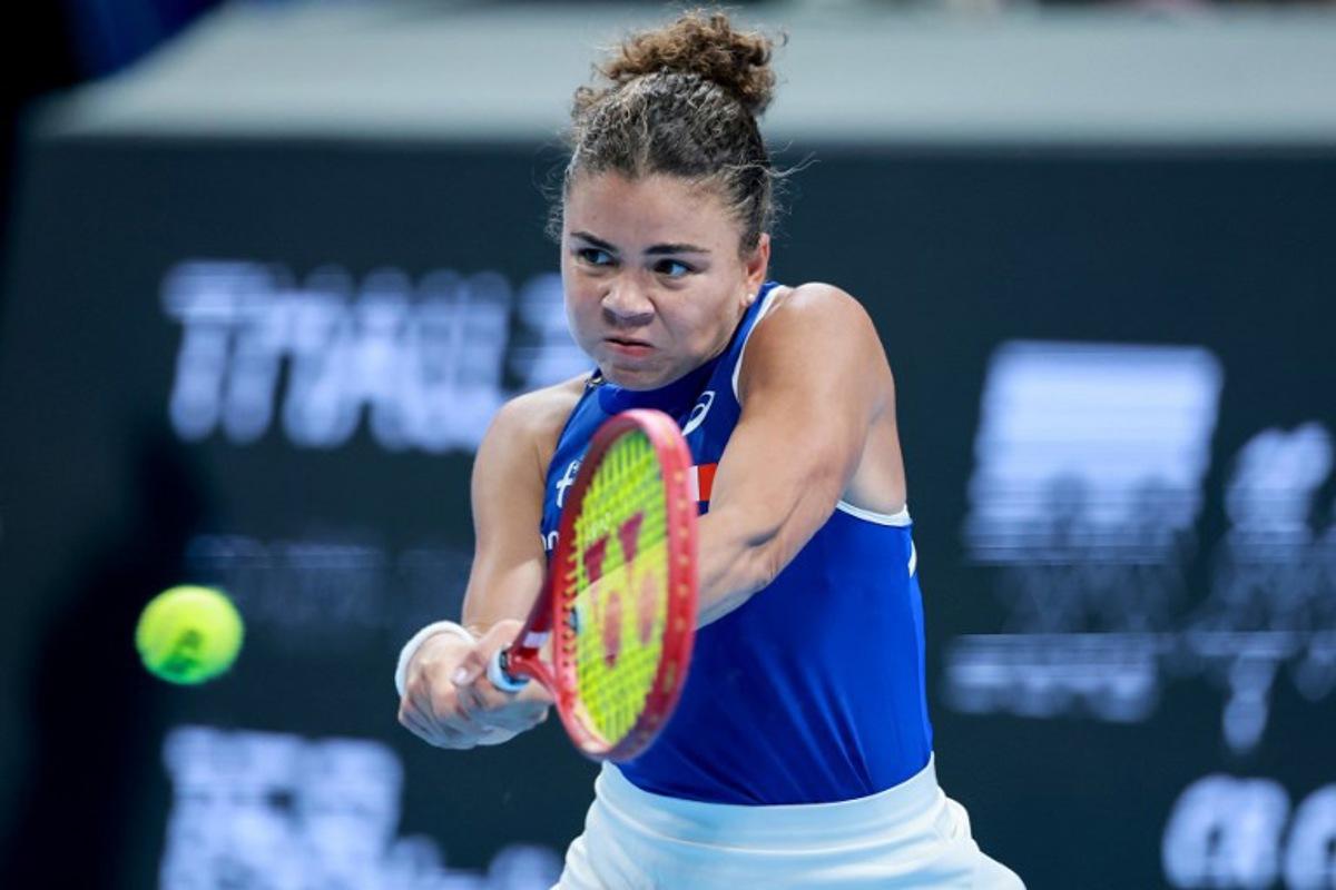 Italy's Jasmine Paolini hits a return to China's Zheng Qinwen during their women's singles quarter-final match at the Billie Jean King Cup tennis tournament in Shenzhen, southern China's Guangdong province on September 24, 2026. CN-STR / AFP
