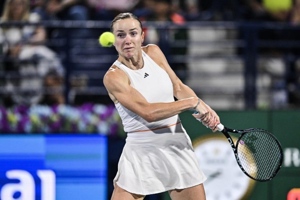 Ukraine's Elina Svitolina hits a return to US' Jessica Pegula during their women's singles final match at the Dubai Duty Free Tennis tournament in Dubai on February 21, 2026. Ryan Lim / AFP