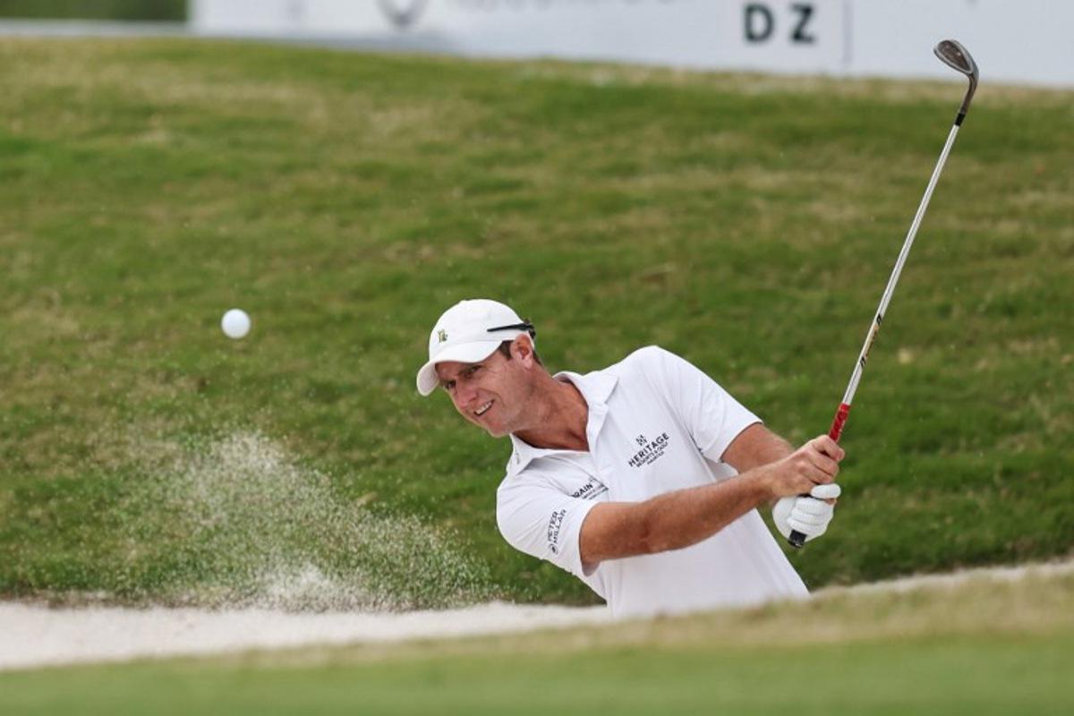 Nicolas Colsaerts of Belgium hits a shot from a bunker during the China Open golf tournament in Shanghai on April 17, 2025. STR / AFP