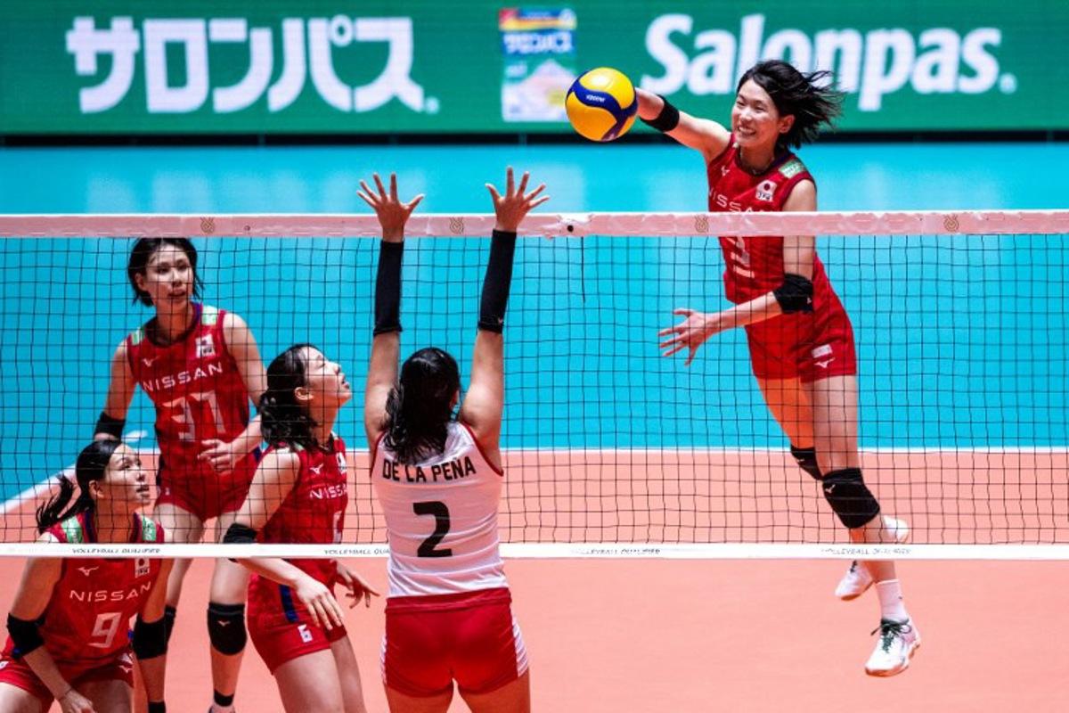 Japan's Sarina Koga (R) spikes the ball during the Volleyball World Cup 2023 Women's match between Japan and Peru at Yoyogi National Stadium in Tokyo on September 16, 2023. Philip FONG / AFP