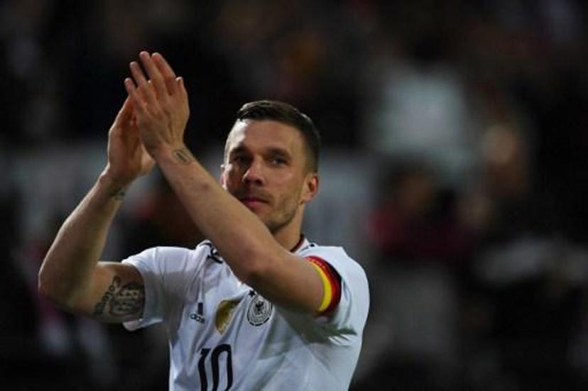 Germany's midfielder Lukas Podolski greets fans after a friendly football match between Germany and England on March 22, 2017 in Dortmund, western Germany. It is Lukas Podolski's last match with the German team. PATRIK STOLLARZ / AFP