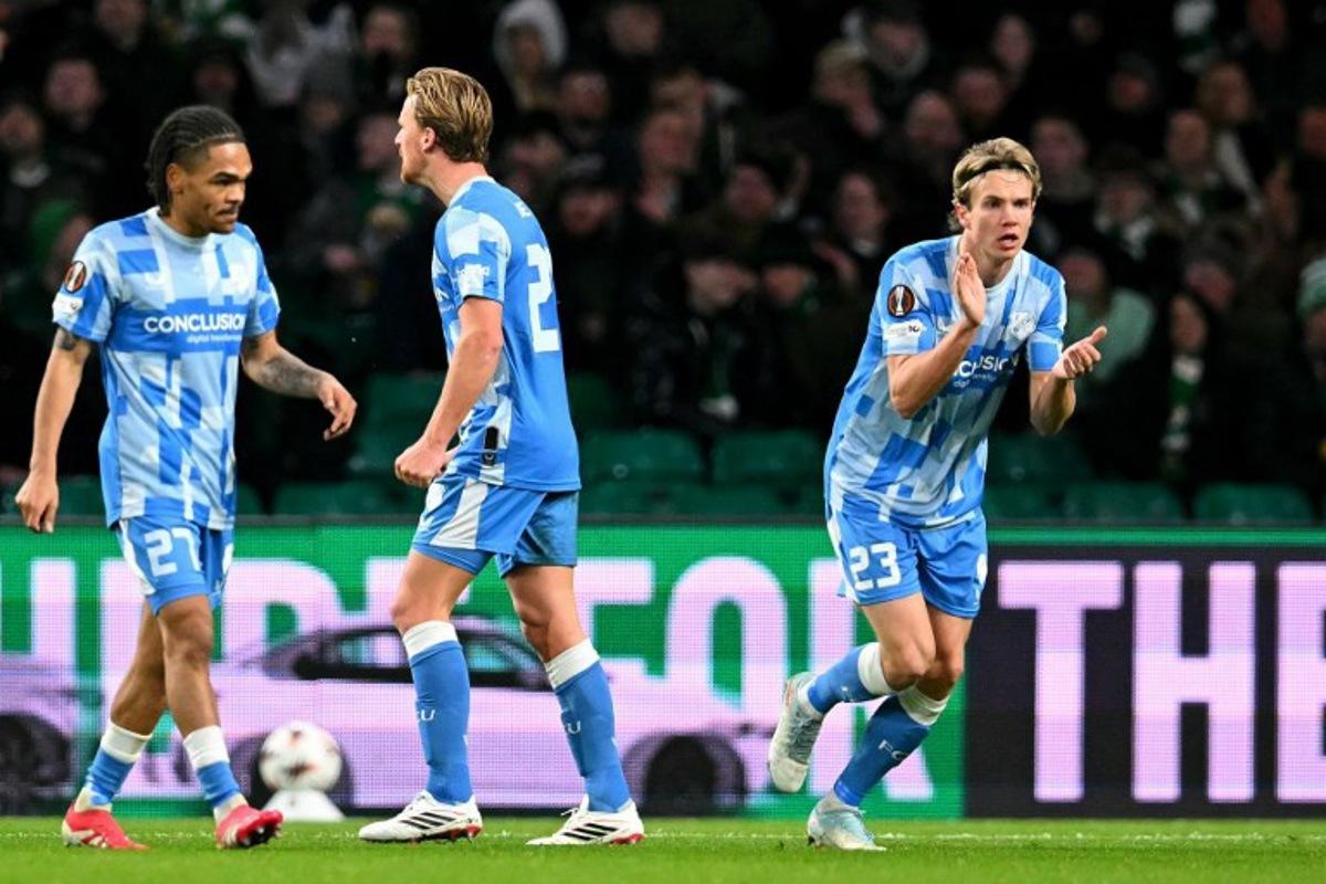 FC Utrecht's Dutch midfielder #20 Dani de Wit (C) celebrates scoring the team's first goal during the UEFA Europa League league-stage football match between Celtic and FC Utrecht at Celtic Park in Glasgow on January 29, 2026. ANDY BUCHANAN / AFP