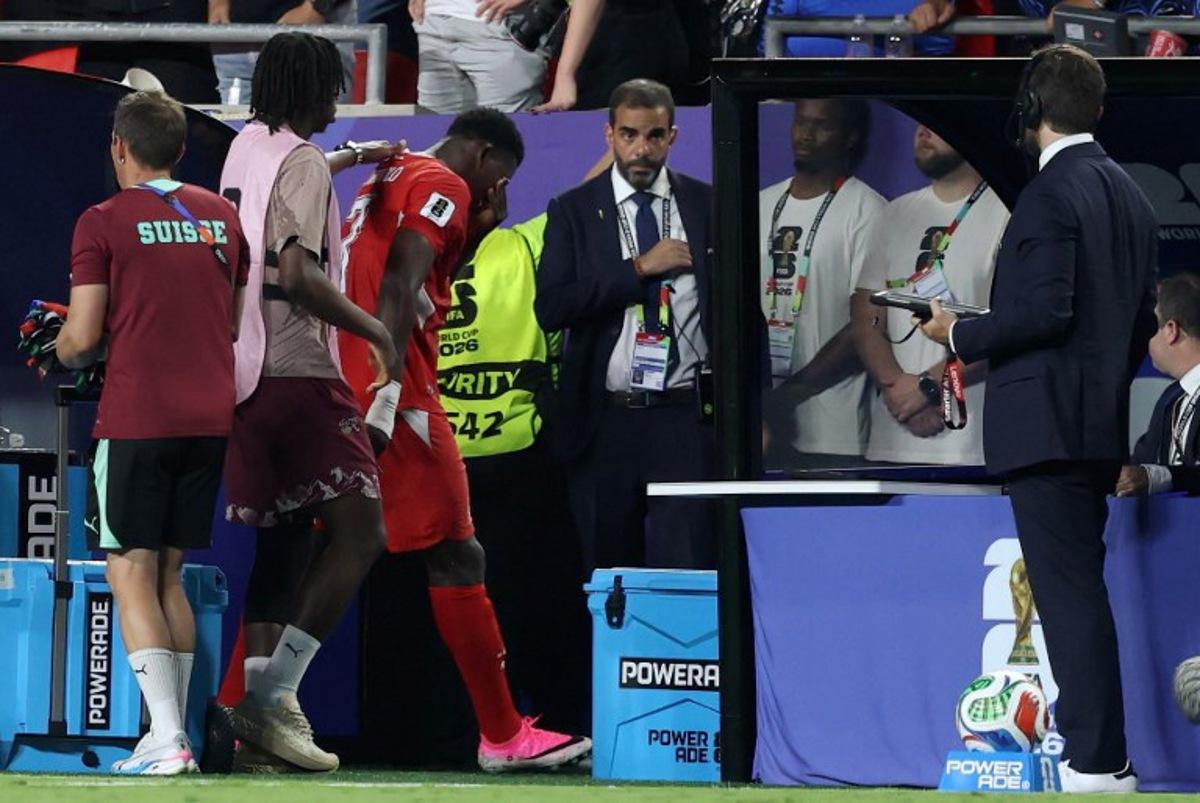 Switzerland's forward #07 Breel Embolo (3rd-L) reacts after he was sent off with a second yellow card during the 2026 World Cup football tournament quarter-final match between Argentina and Switzerland at the Kansas City Stadium in Kansas City on July 11, 2026. Thomas COEX / AFP