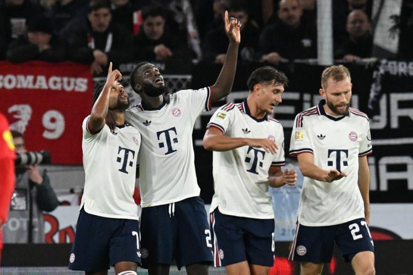 Bayern Munich's German forward #07 Serge Gnabry (L) celebrates with Bayern Munich's French defender #02 Dayot Upamecano (2nd L) after scoring the 0:2 goal during the German first division Bundesliga football match between SC Freiburg and FC Bayern Munich in Freiburg, south-western Germany, on October 25, 2026. THOMAS KIENZLE / AFP