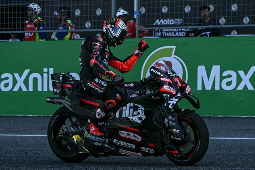 Aprilia Racing's Italian rider Marco Bezzecchi celebrates his victory after crossing the finish line during the MotoGP Thailand Grand Prix at the Buriram International Circuit in Buriram on March 1, 2026. Lillian SUWANRUMPHA / AFP