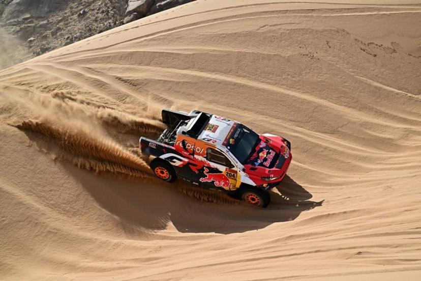 Toyota Gazoo Racing W2rc's Australian driver Toby Price and Spanish copilot Armand Monleon compete in Stage 12 of the 48th edition of the Dakar Rally 2026, between al-Henakiyah and Yanbu, Saudi Arabia, on January 16, 2026. Giuseppe CACACE / AFP
