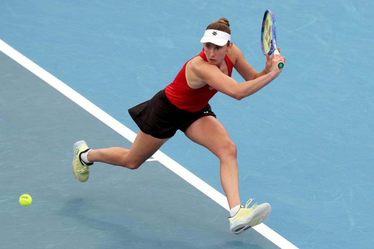 Belgium's Elise Mertens hits a return to China's Zhu Lin during their women's singles match at the United Cup tennis tournament on Ken Rosewall Arena in Sydney on January 3, 2026. DAVID GRAY / AFP