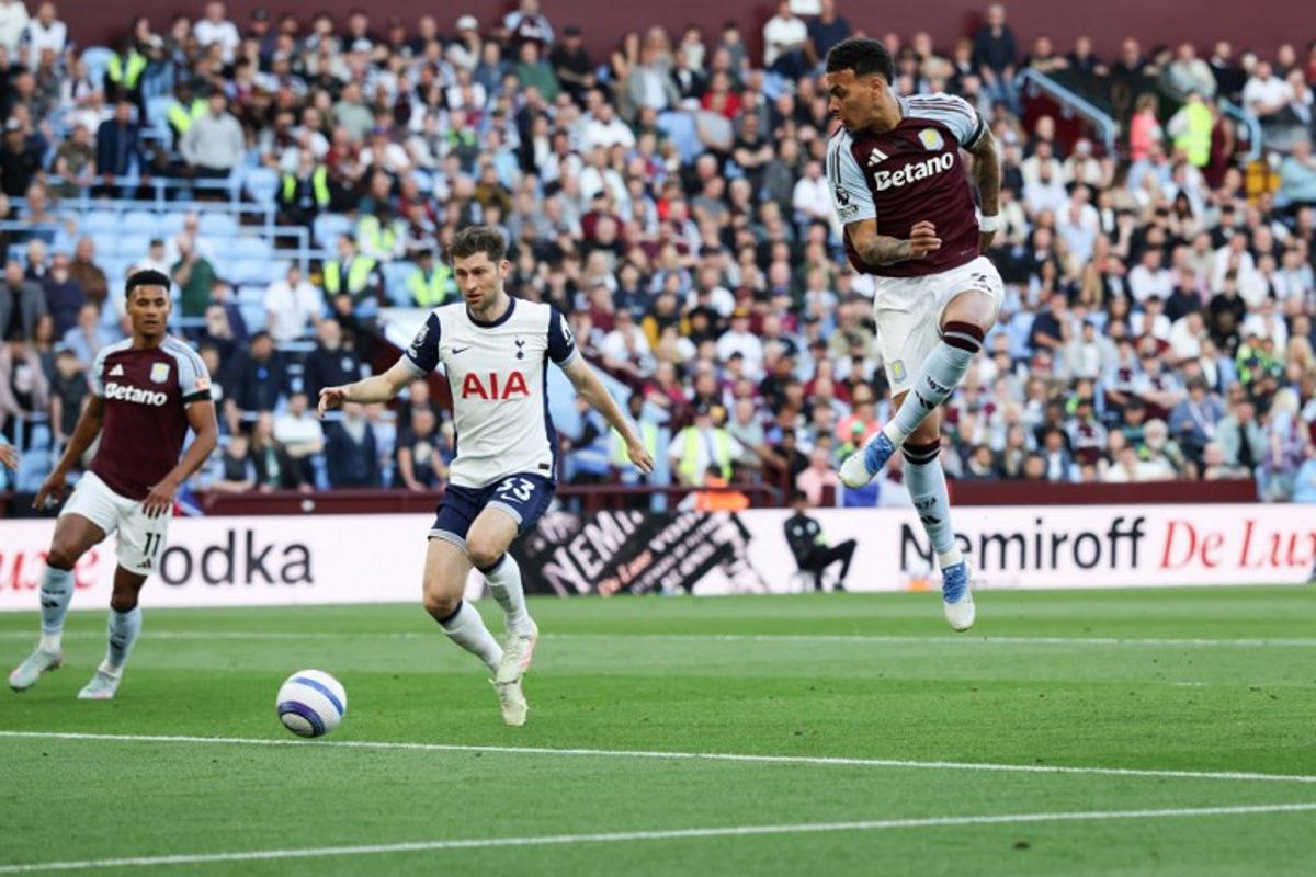 Aston Villa's English midfielder #27 Morgan Rogers (R) shoots but misses to score during the English Premier League football match between Aston Villa and Tottenham Hotspur at Villa Park in Birmingham, central England on May 16, 2025. Darren Staples / AFP