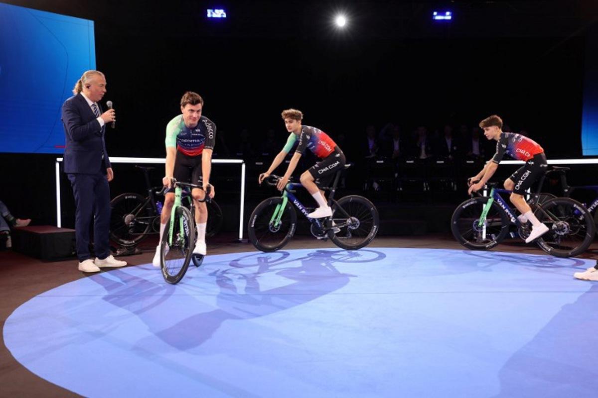 (From 2L) Decathlon-CMA CGM's Dutch cyclist Olav Kooij, French rider Paul Seixas and French rider Antoine L'Hote attend the presentation of the new Decathlon CMA-GGM cycling team at the Decathlon Campus in Villeneuve-d'Ascq, northern France on December 11, 2025. Francois LO PRESTI / AFP