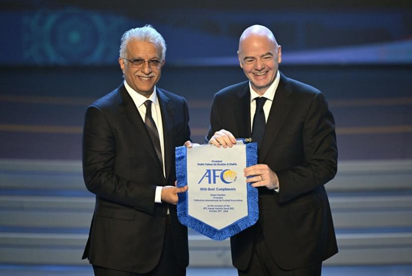 FIFA president Gianni Infantino (R) poses with Sheikh Salman bin Ibrahim al-Khalifa (L), president of the Asian Football Confederation (AFC), during the AFC Annual Awards 2023 ceremony in Seoul on October 29, 2024. JUNG YEON-JE / AFP