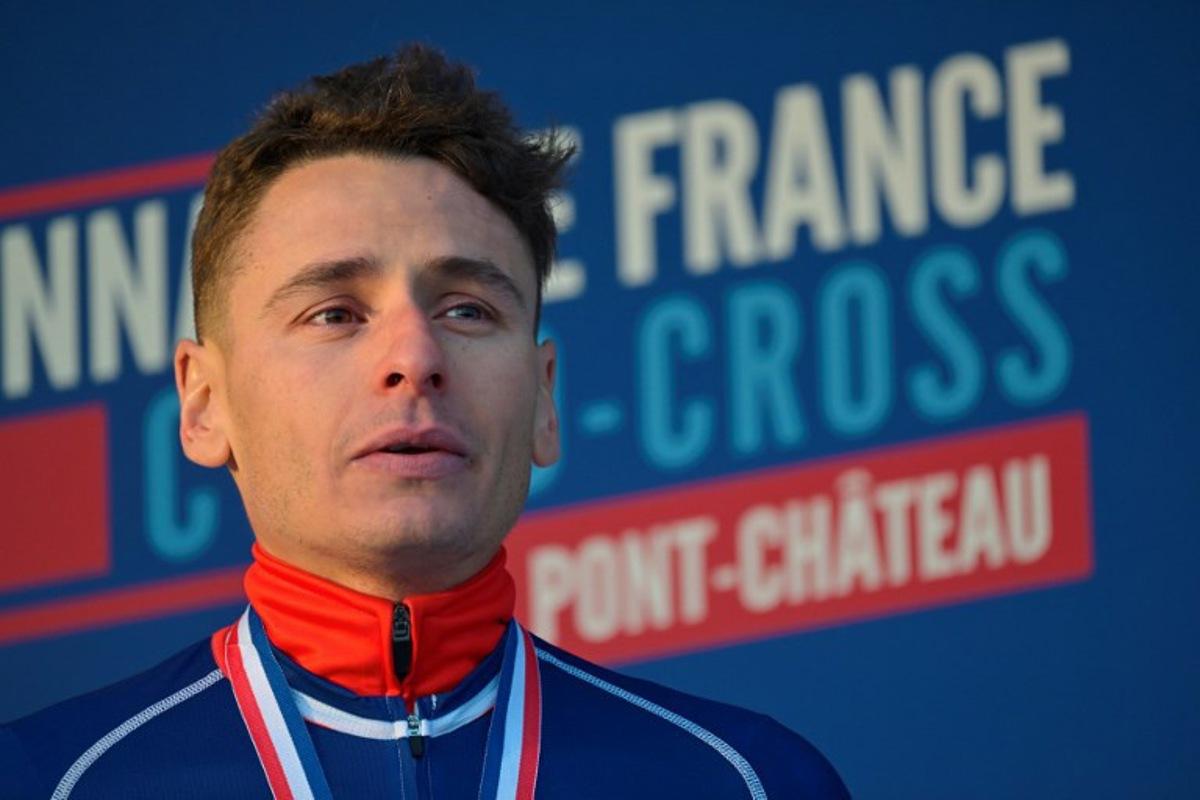 Gold medalist Clement Venturini celebrates during the podium ceremony of the France's men cyclo-cross French men's elite cyclo cross Championships in Pontchateau, western France on January 12, 2025. Damien MEYER / AFP