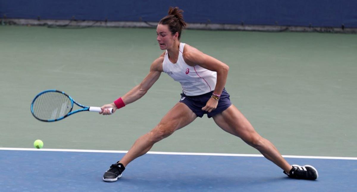 France's Lois Boisson returns the ball to Switzerland's Viktorija Golubic during their women's singles first round tennis match on day three of the US Open tennis tournament at the USTA Billie Jean King National Tennis Center in New York City, on August 26, 2025. TIMOTHY A. CLARY / AFP