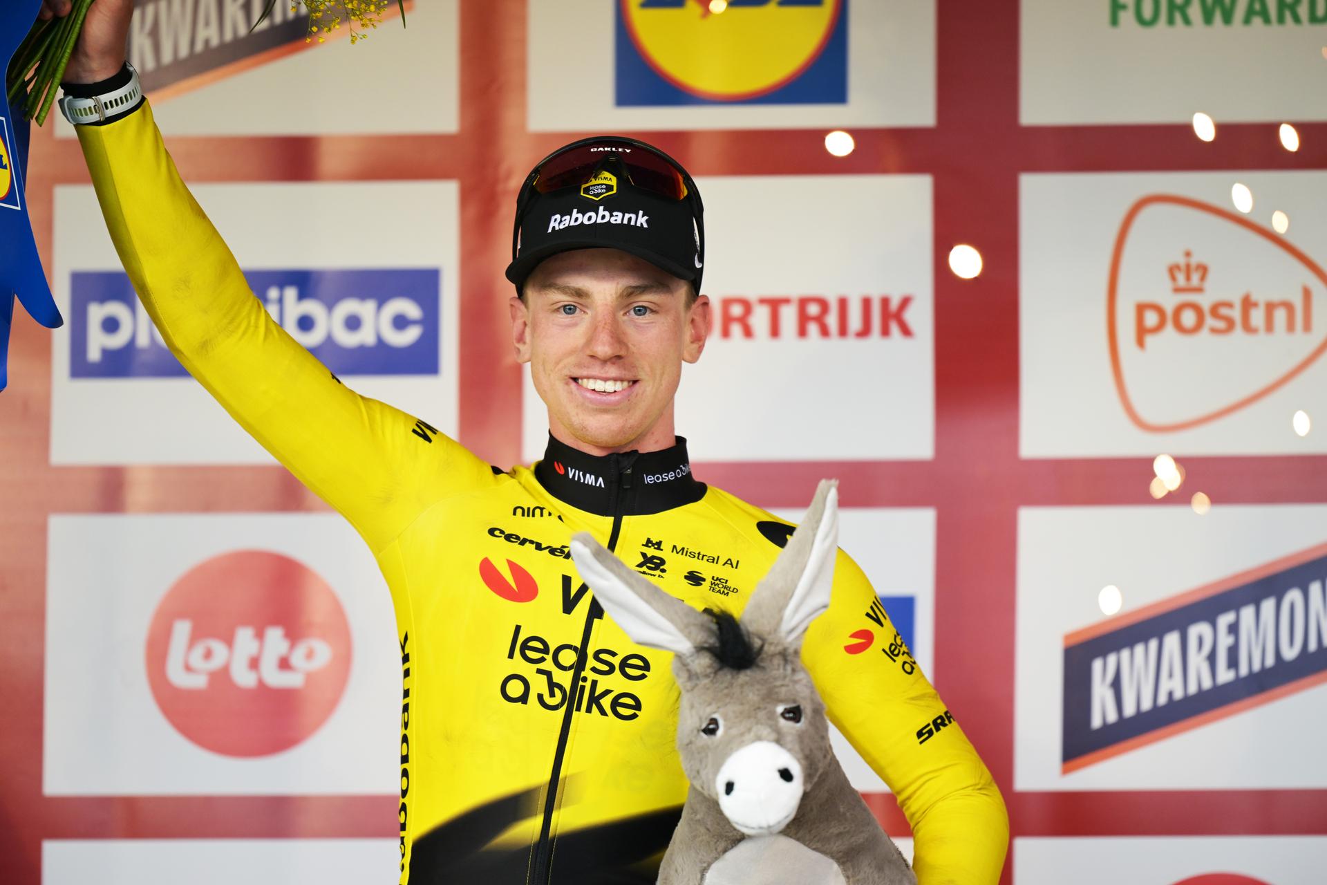 Great Britain's Matthew Brennan of Team Visma-Lease a Bike celebrates on the podium after winning the 78th edition of the men elite race of the Kuurne-Brussels-Kuurne one day cycling race, 195 km from Kuurne to Kuurne via Brussels, Sunday 01 March 2026. BELGA PHOTO DAVID PINTENS