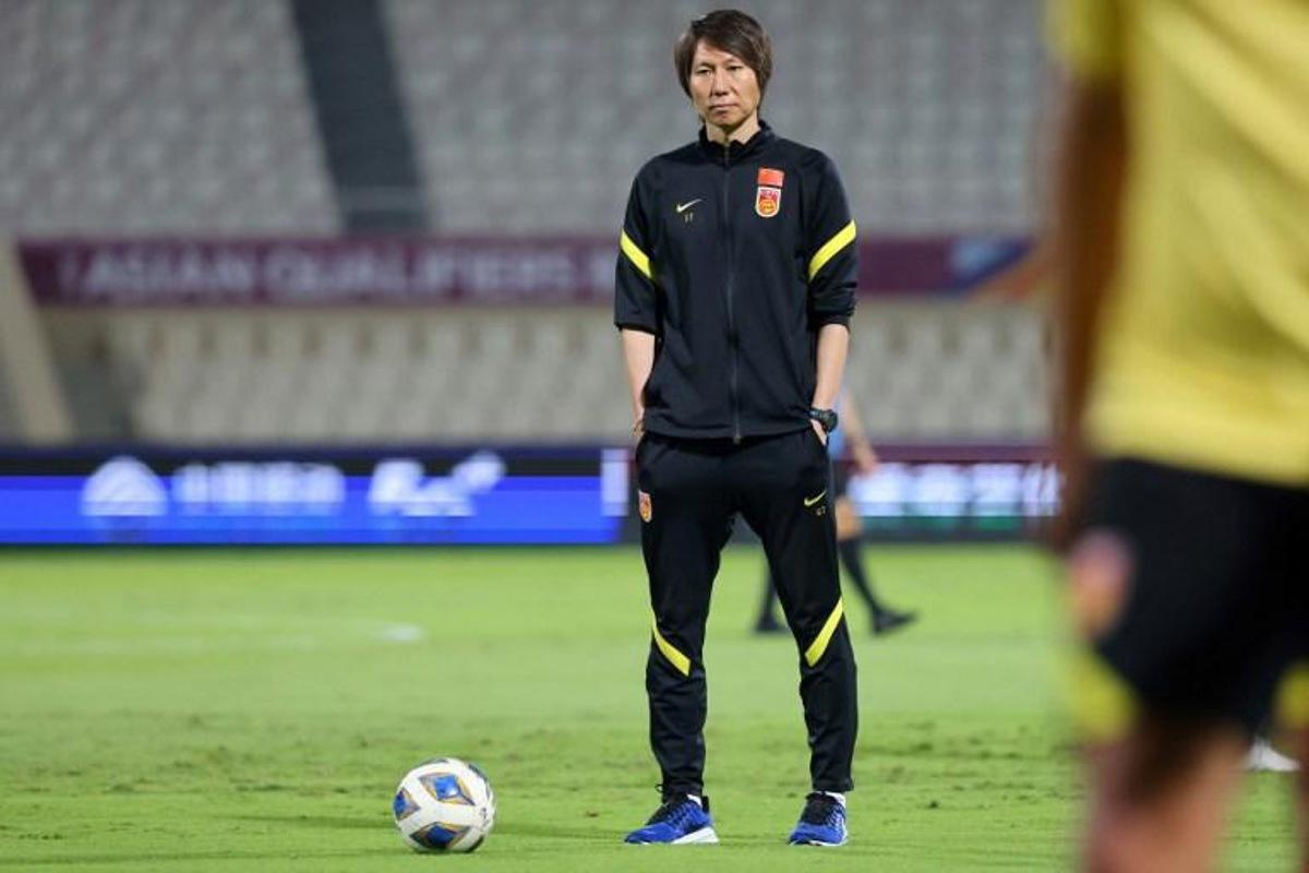 China's coach Li Tie looks on ahead of the 2022 Qatar World Cup Asian Qualifiers football match between China and Oman, at the Sharjah Football Stadium in the Emirati city, on November 11, 2021. Giuseppe CACACE / AFP