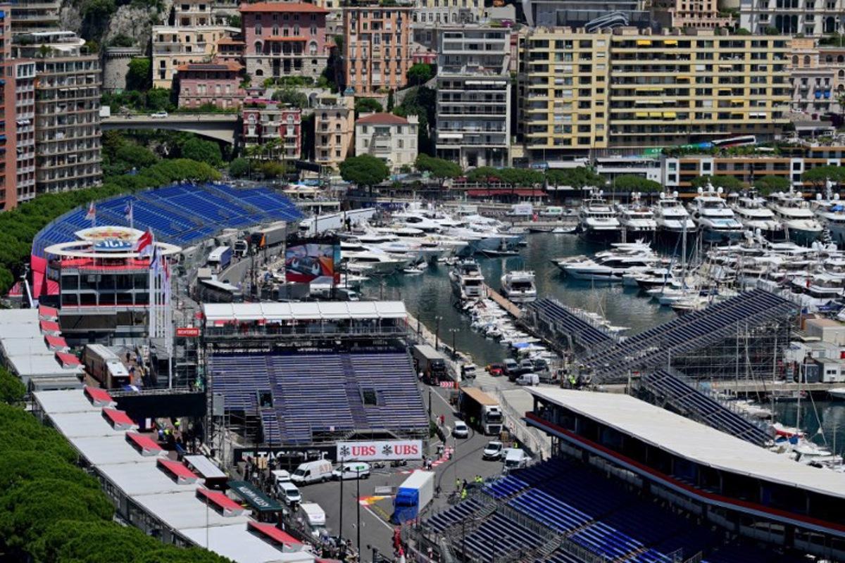 This photograph taken on May 22, 2024 shows yachts docked at the Monte Carlo harbour in front of the stands of the Circuit de Monaco, four days ahead of the Formula One Monaco Grand Prix. Andrej ISAKOVIC / AFP